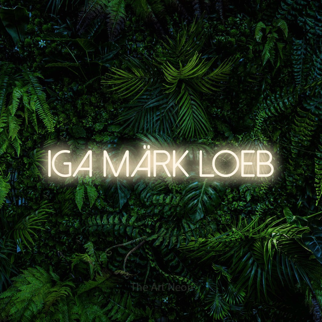LED neon sign reading “IGA MÄRK LOEB”, arranged in a single line.