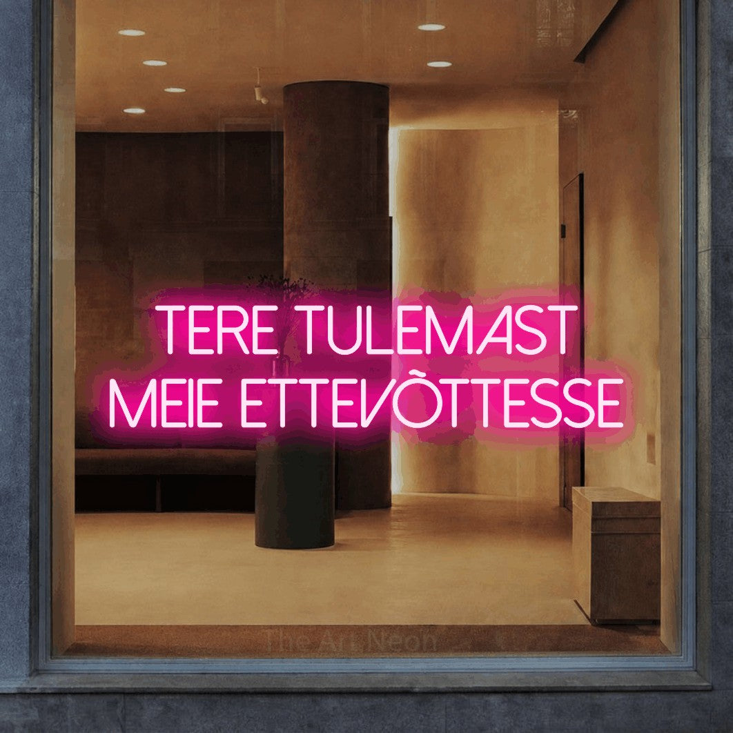 LED neon sign reading “tere tulemast meie ettevõttesse”, arranged in two lines.