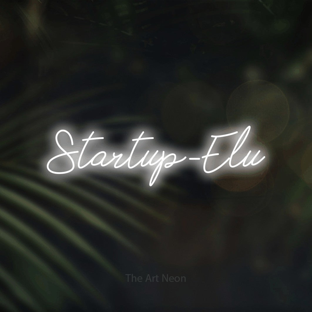 LED neon sign reading “Startup-Elu”, arranged in a single line.