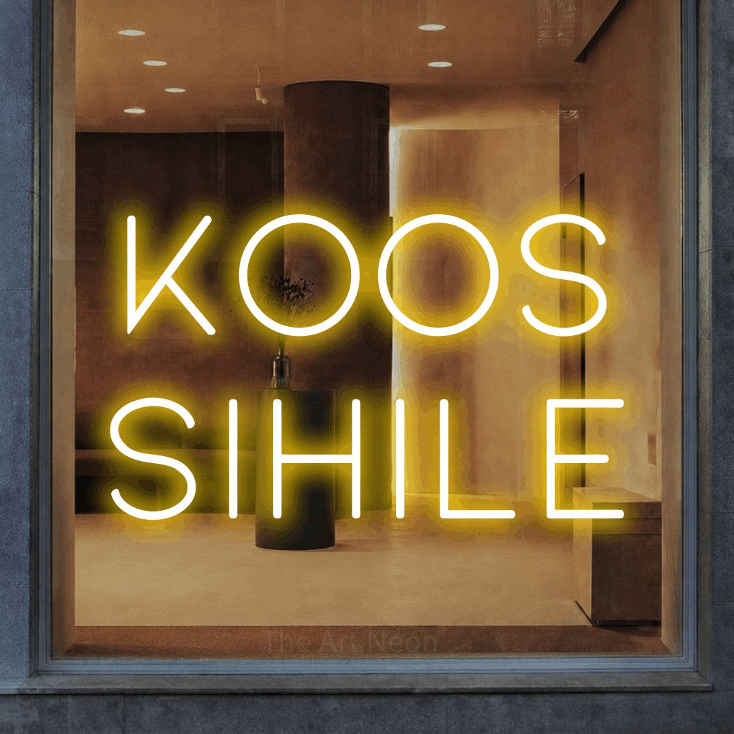 LED neon sign reading “Koos Sihile”, arranged in two lines.