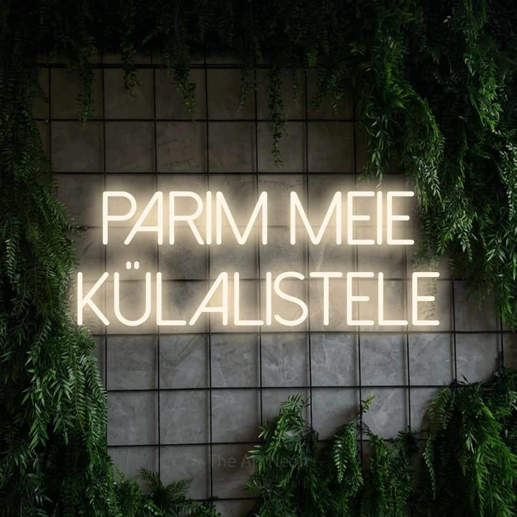 LED neon sign reading “parim meie külalistele”, arranged in two lines.