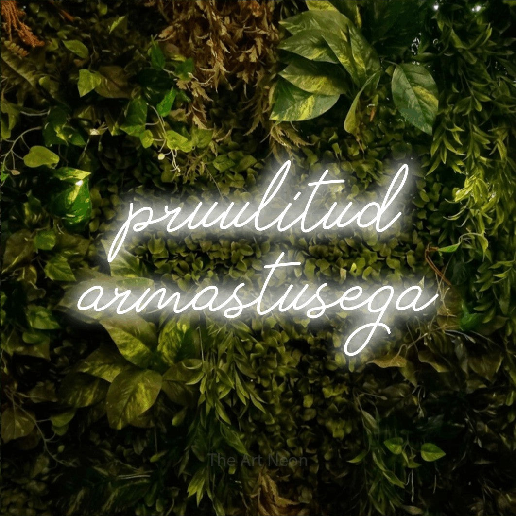 LED neon sign reading “pruulitud armastusega”, arranged in two lines.