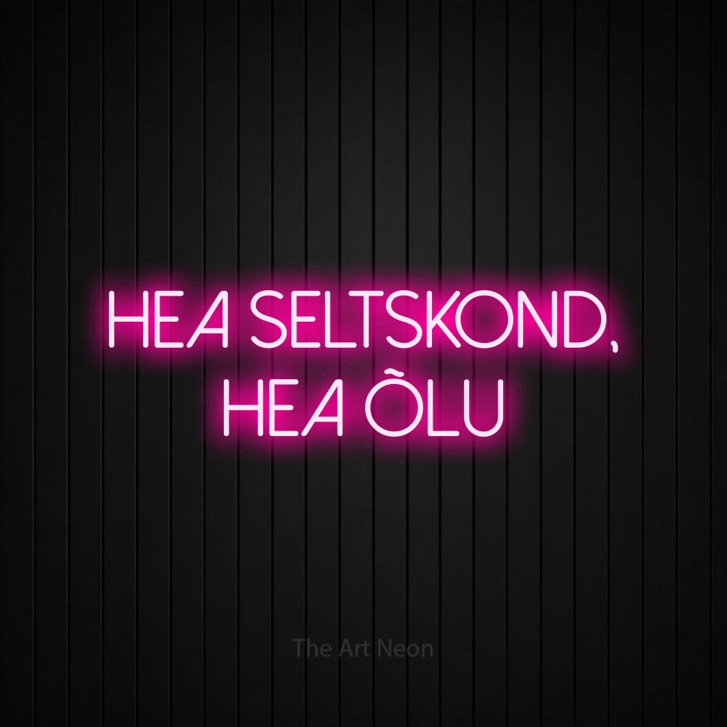 LED neon sign reading “HEA SELTSKOND, HEA ÕLU”, arranged in two lines.