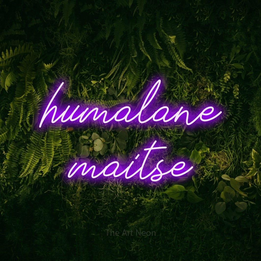 LED neon sign reading “humalane maitse”, arranged in two lines.