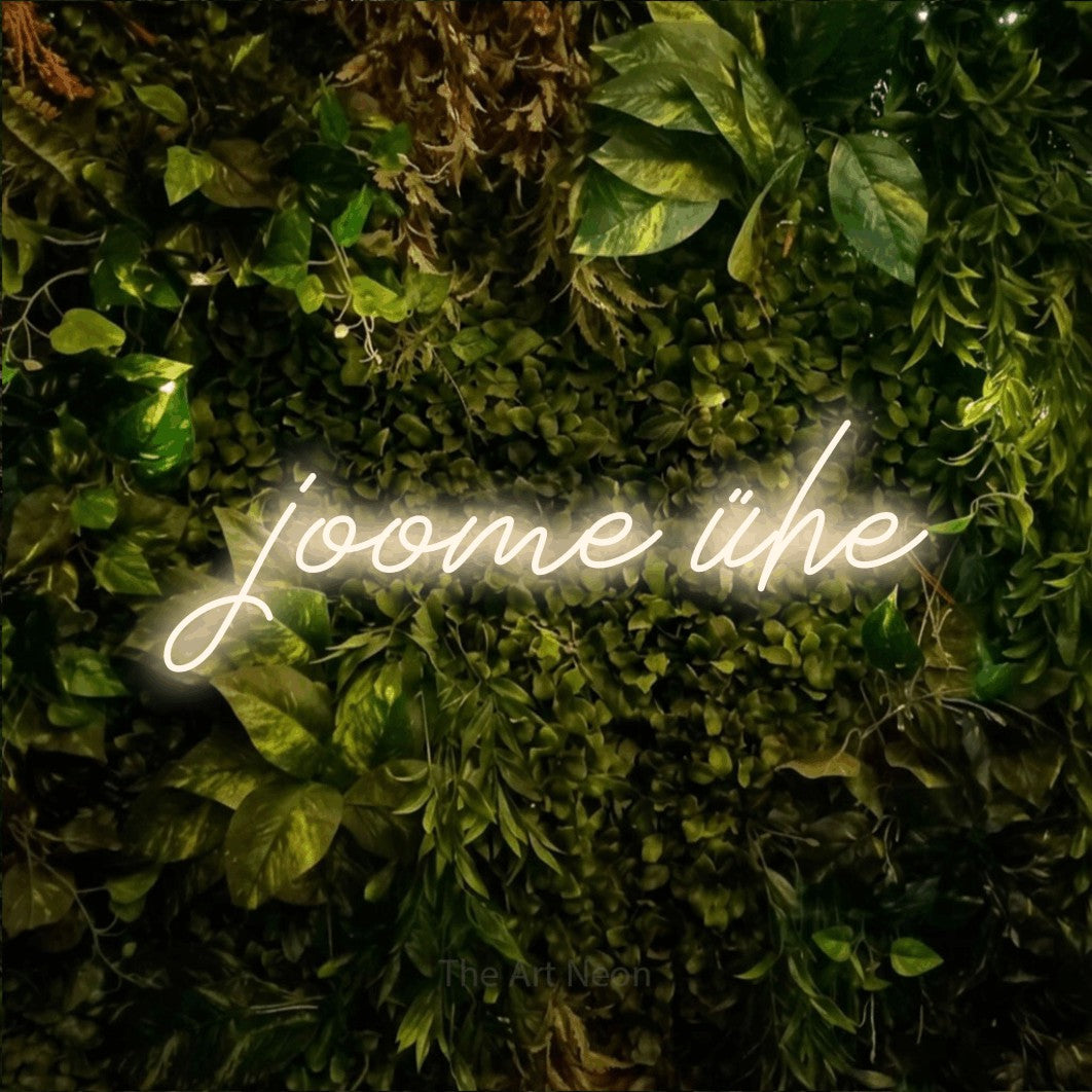 LED neon sign reading “joome ühe”, arranged in a single line.