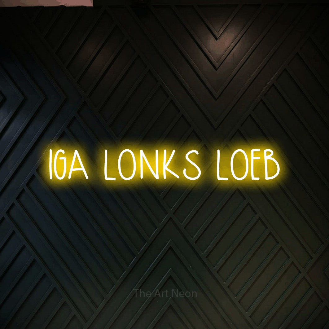 LED neon sign reading “IGA LONKS LOEB”, arranged in a single line.