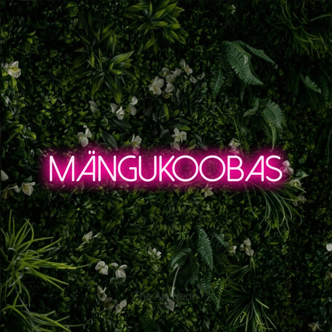 LED neon sign reading “MÄNGUKOOBAS”, arranged in a single line.