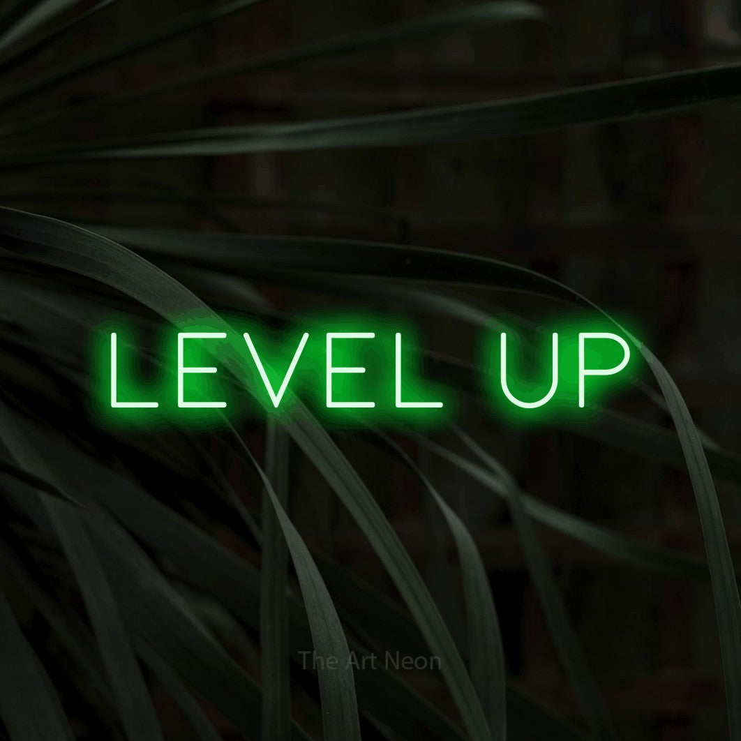 LED neon sign reading “level up”, arranged in a single line.