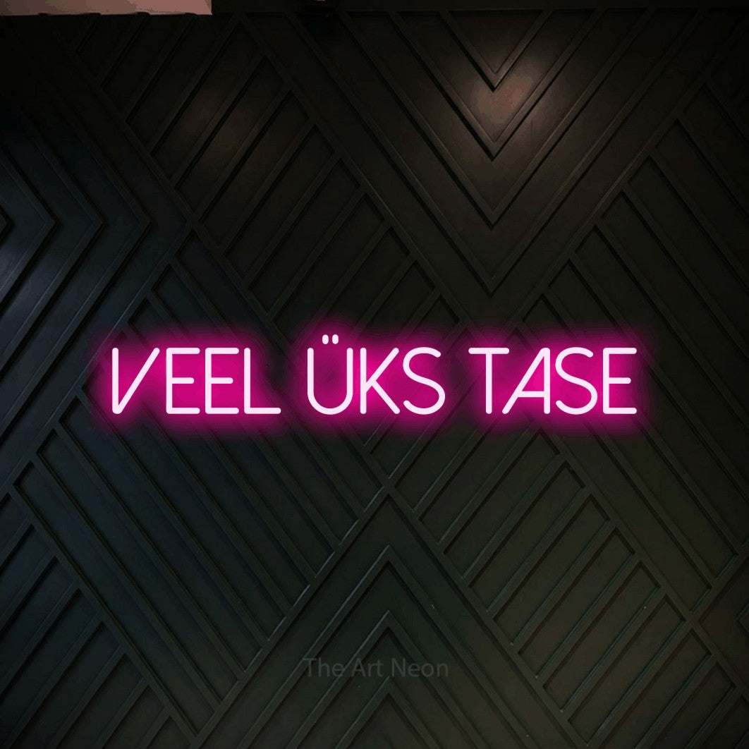 LED neon sign reading “Veel Üks Tase”, arranged in a single line.