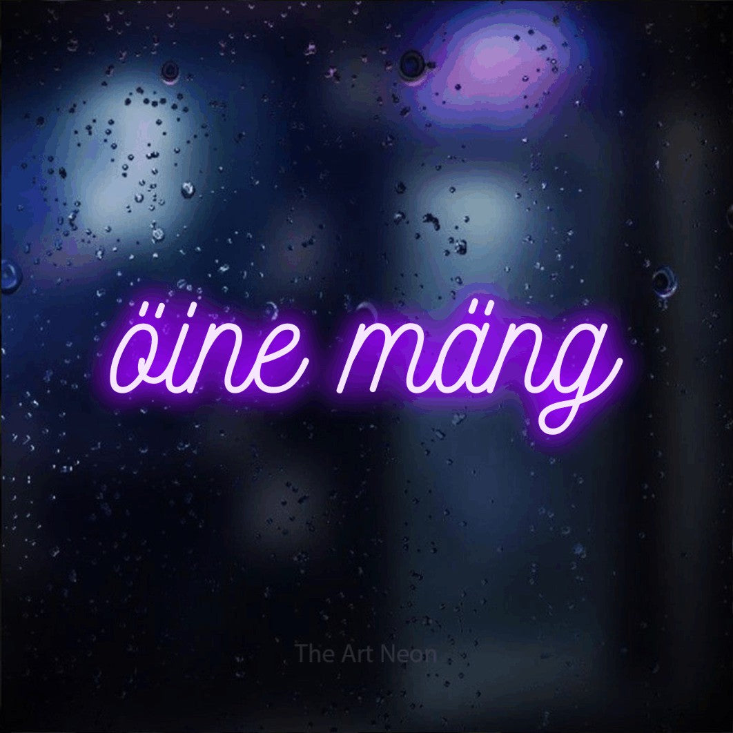 LED neon sign reading “öine mäng”, arranged in a single line.