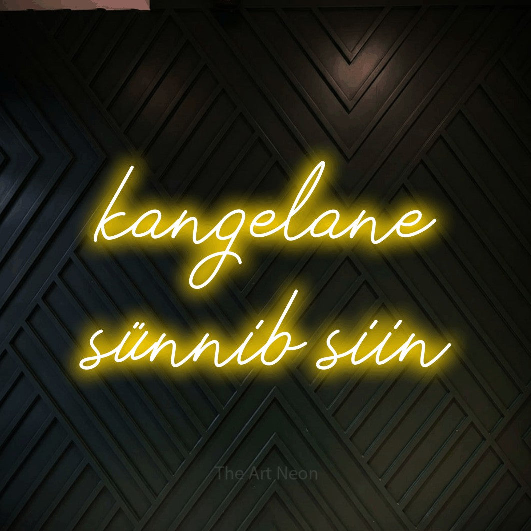 LED neon sign reading “kangelane sünnib siin”, arranged in two lines.