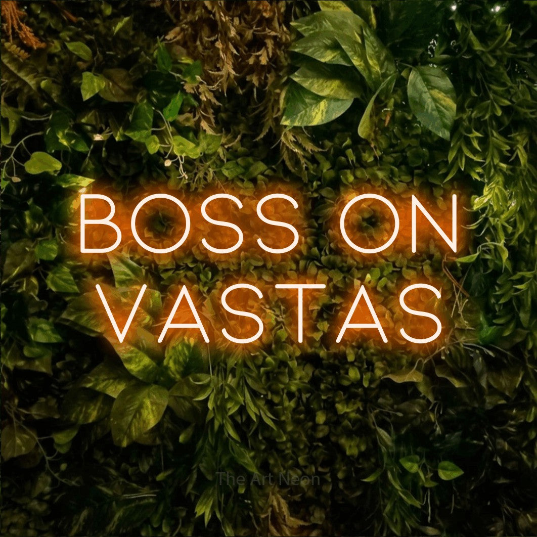 LED neon sign reading “Boss On Vastas”, arranged in two lines.
