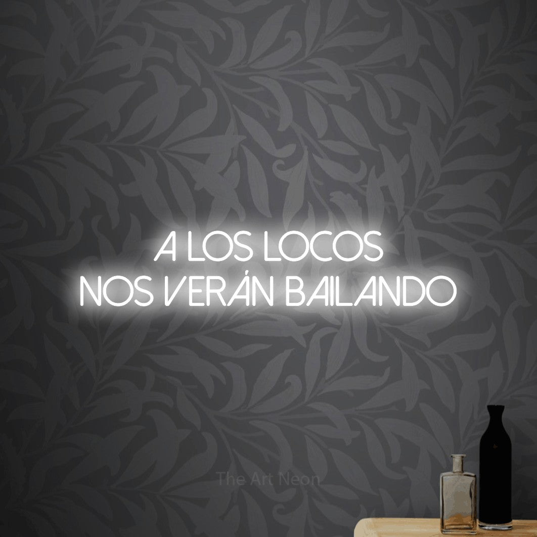 LED neon sign reading “A LOS LOCOS NOS VERÁN BAILANDO”, arranged in 2 lines.