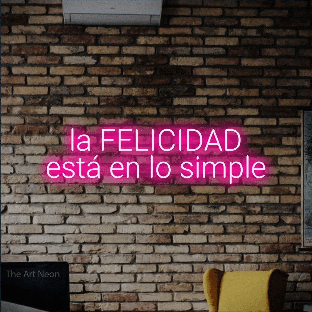LED neon sign reading “la FELICIDAD está en lo simple”, arranged in 2 lines.