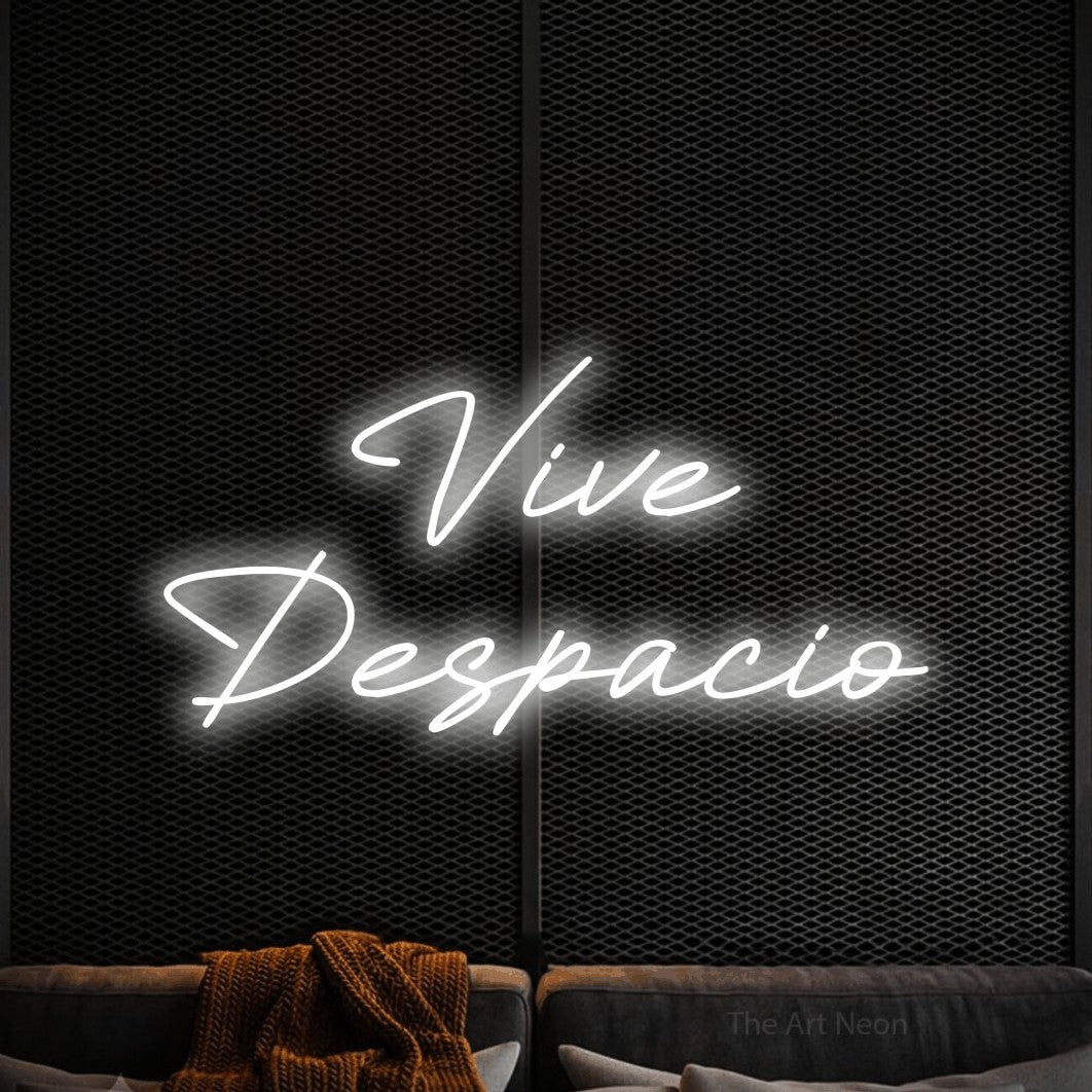 LED neon sign reading “Vive Despacio”, arranged in 2 lines.