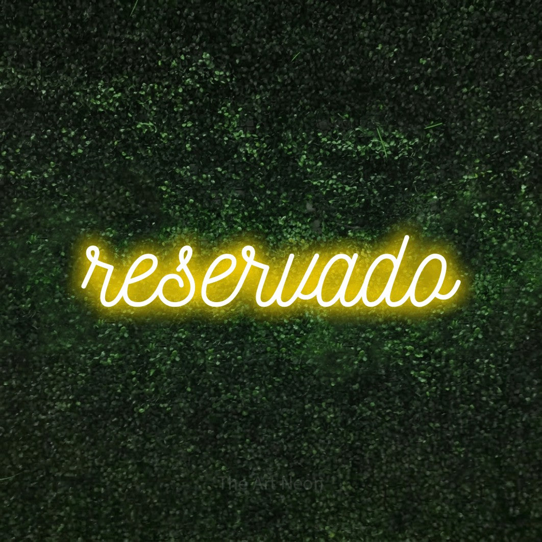 LED neon sign reading “reservado”, arranged in a single line.