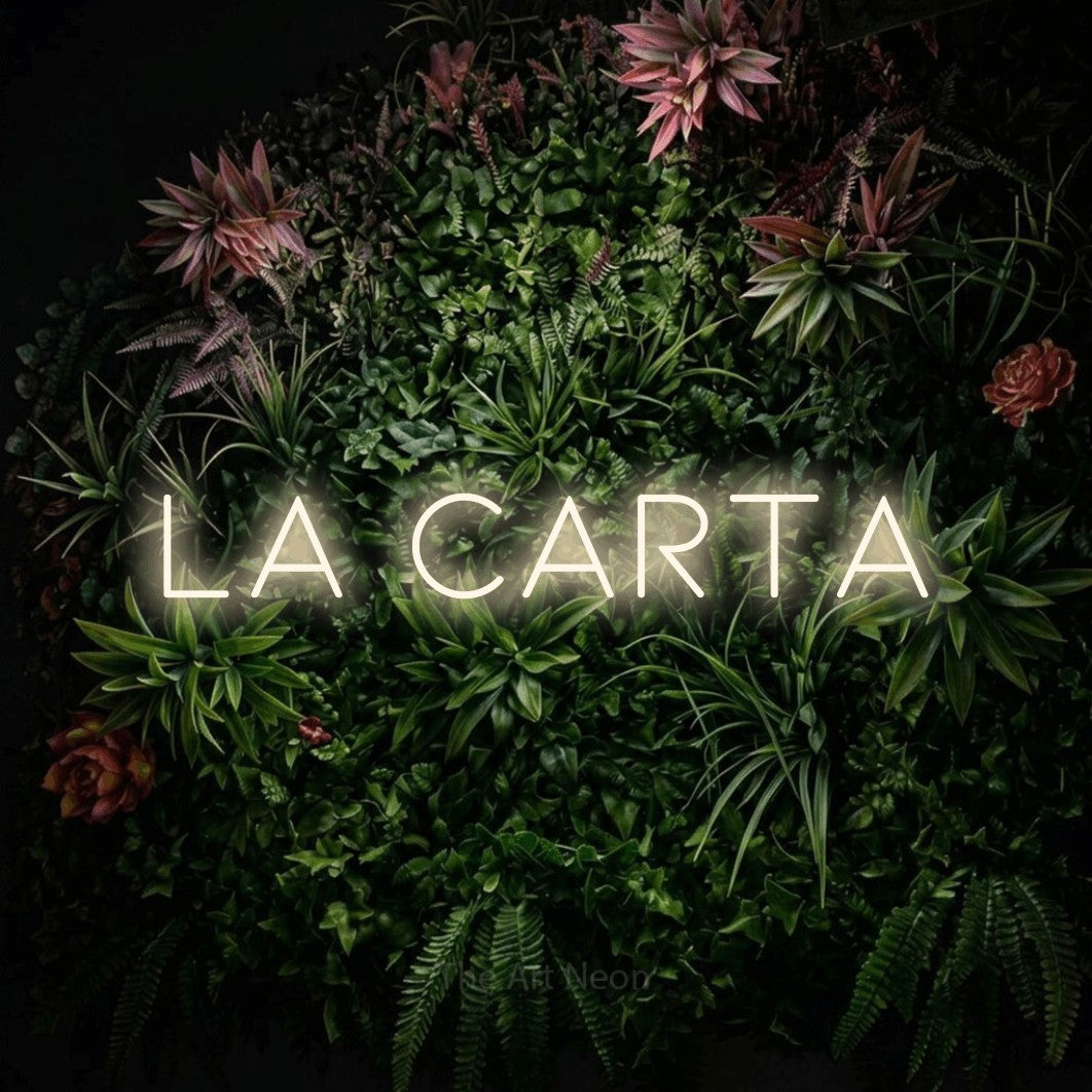 LED neon sign reading “la CARTA”, arranged in a single line.