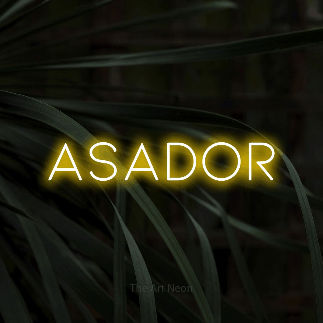 LED neon sign reading “ASADOR”, arranged in a single line.