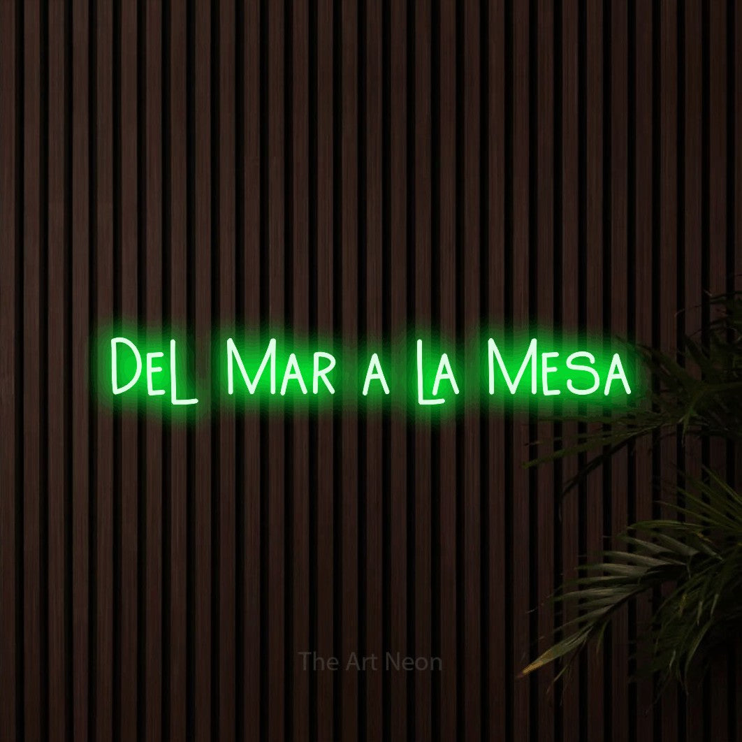 LED neon sign reading “Del Mar a la Mesa”, arranged in a single line.
