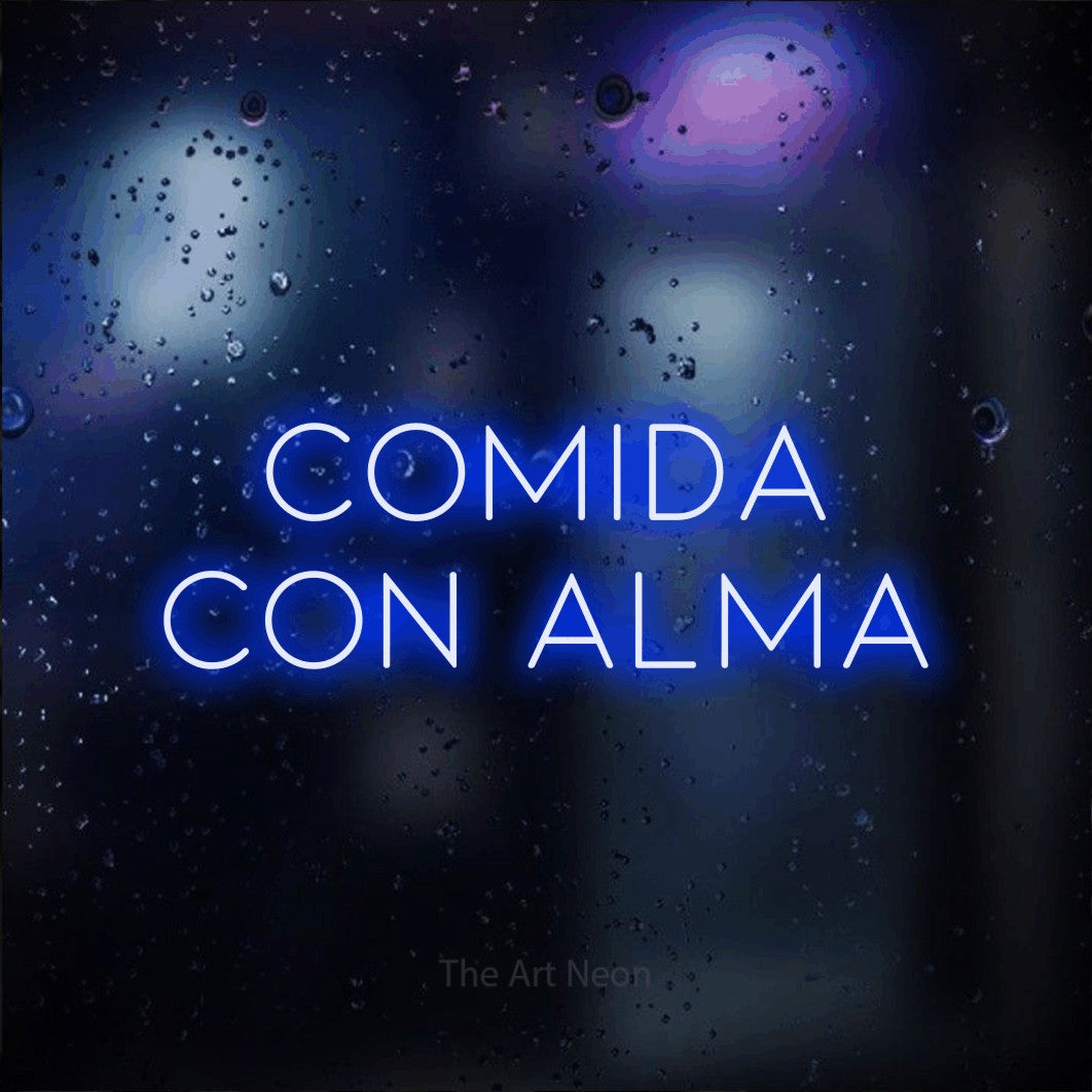 LED neon sign reading “comida con alma”, arranged in 2 lines.