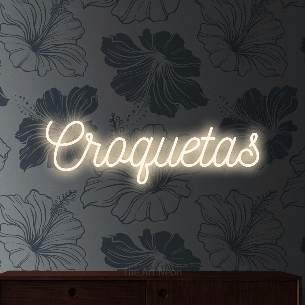 LED neon sign reading “Croquetas”, arranged in a single line.