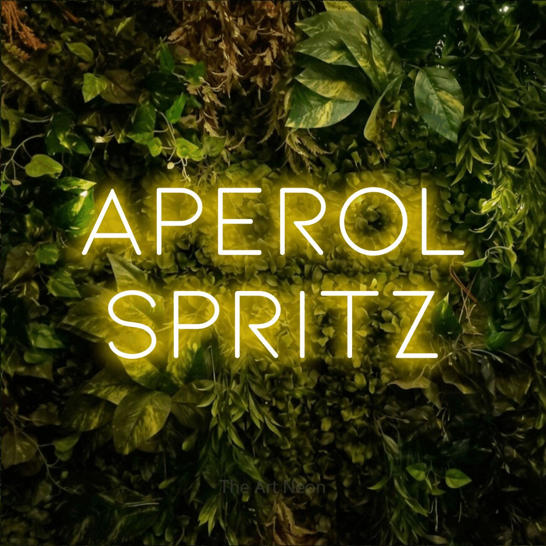 LED neon sign reading “Aperol Spritz”, arranged in 2 lines.