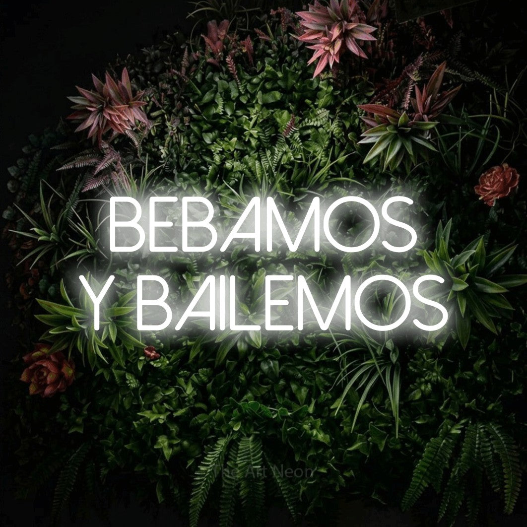 LED neon sign reading “Bebamos y bailemos”, arranged in 2 lines.