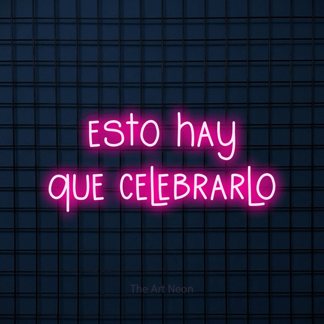 LED neon sign reading “esto hay que celebrarlo”, arranged in 2 lines.