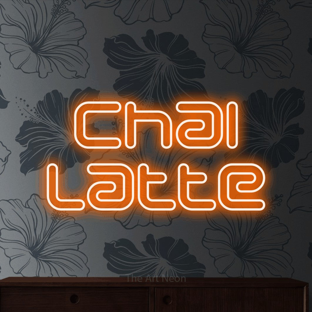 LED neon sign reading “chai latte”, arranged in 2 lines.