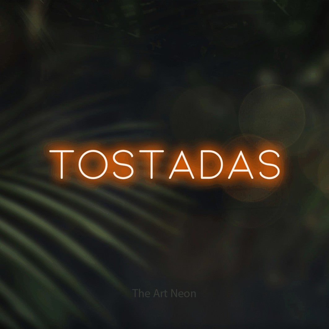LED neon sign reading “tostadas”, arranged in a single line.