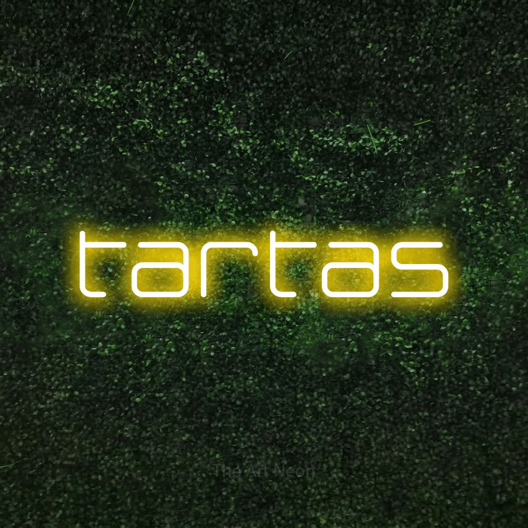 LED neon sign reading “tartas”, arranged in a single line.