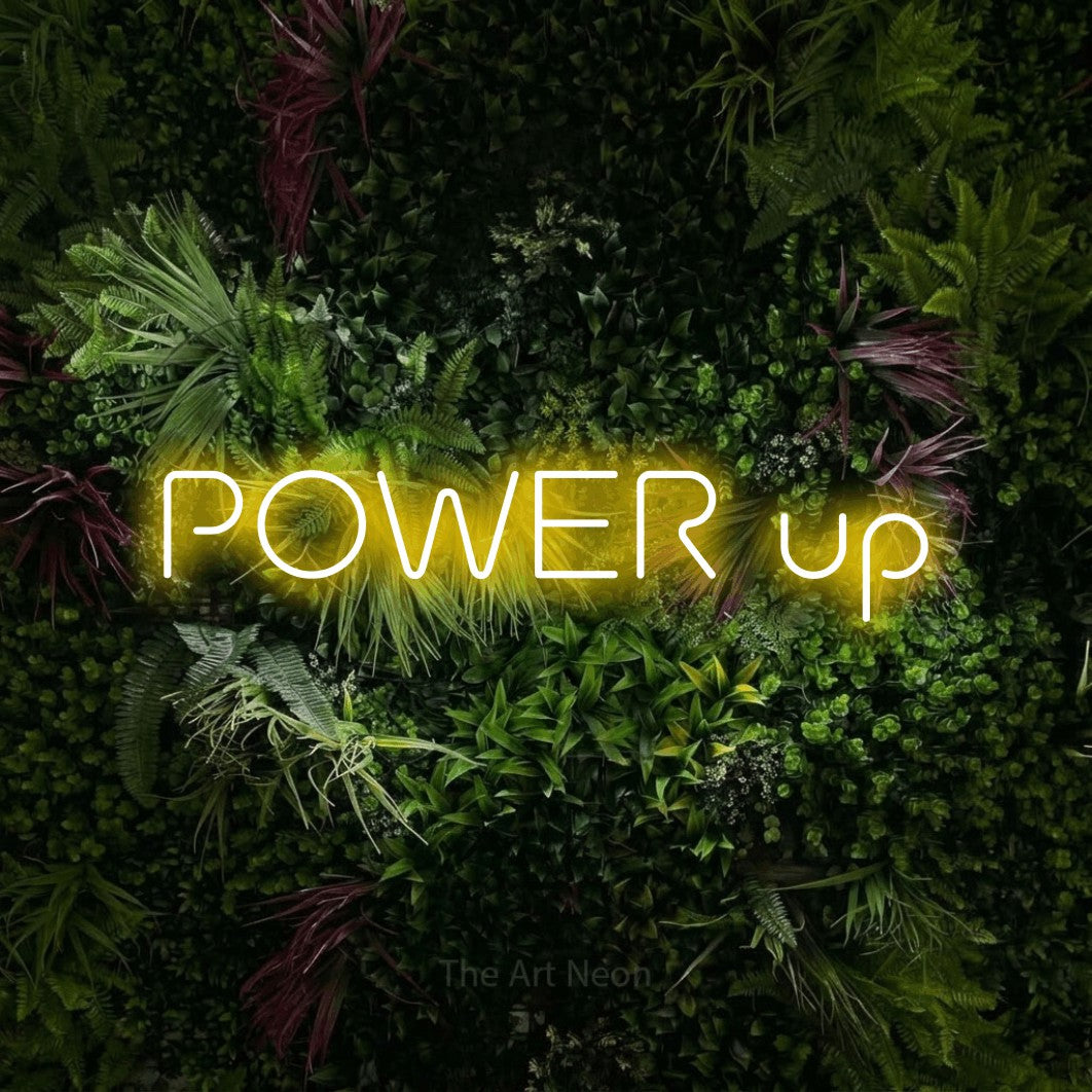 LED neon sign reading “POWER up”, arranged in a single line.