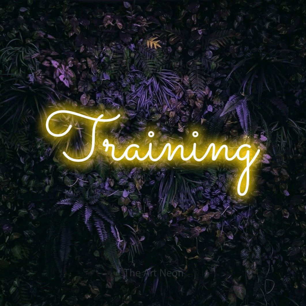 LED neon sign reading “Training”, arranged in a single line.