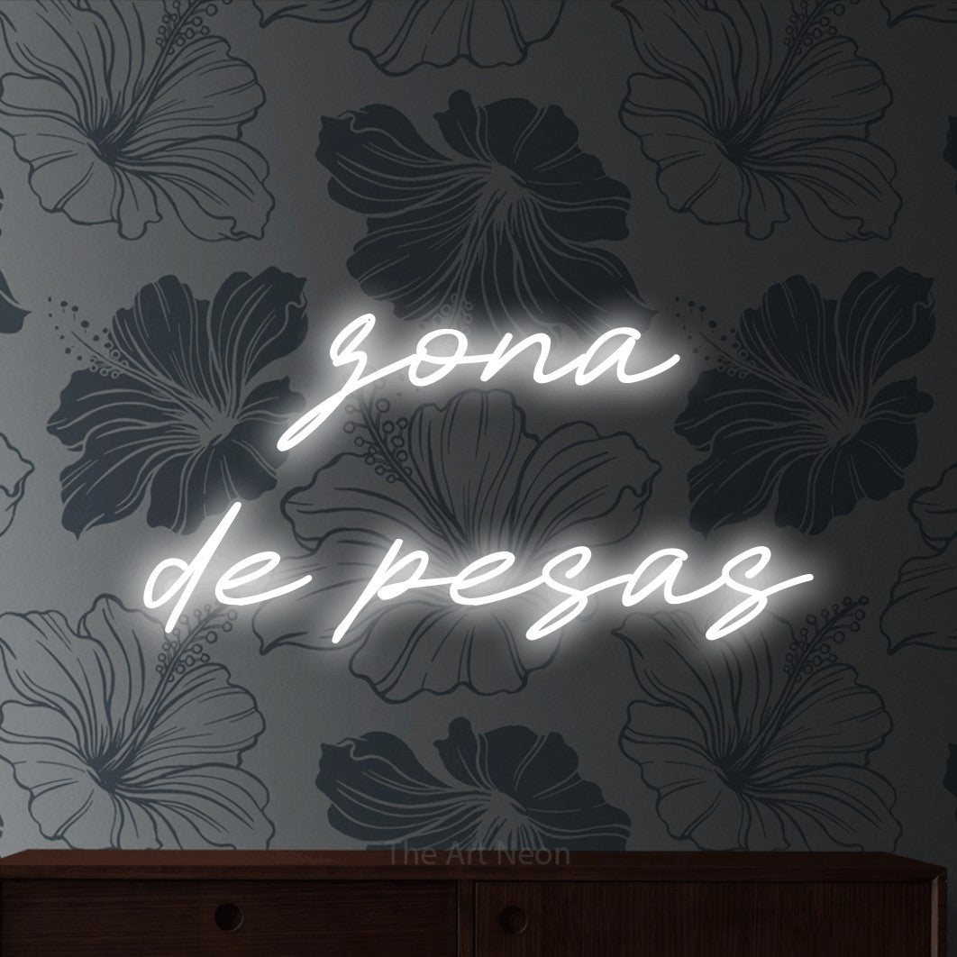 LED neon sign reading “zona de pesas”, arranged in 2 lines.