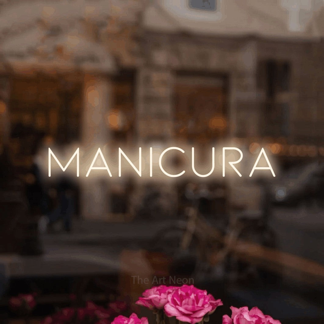 LED neon sign reading “MANICURA”, arranged in a single line.