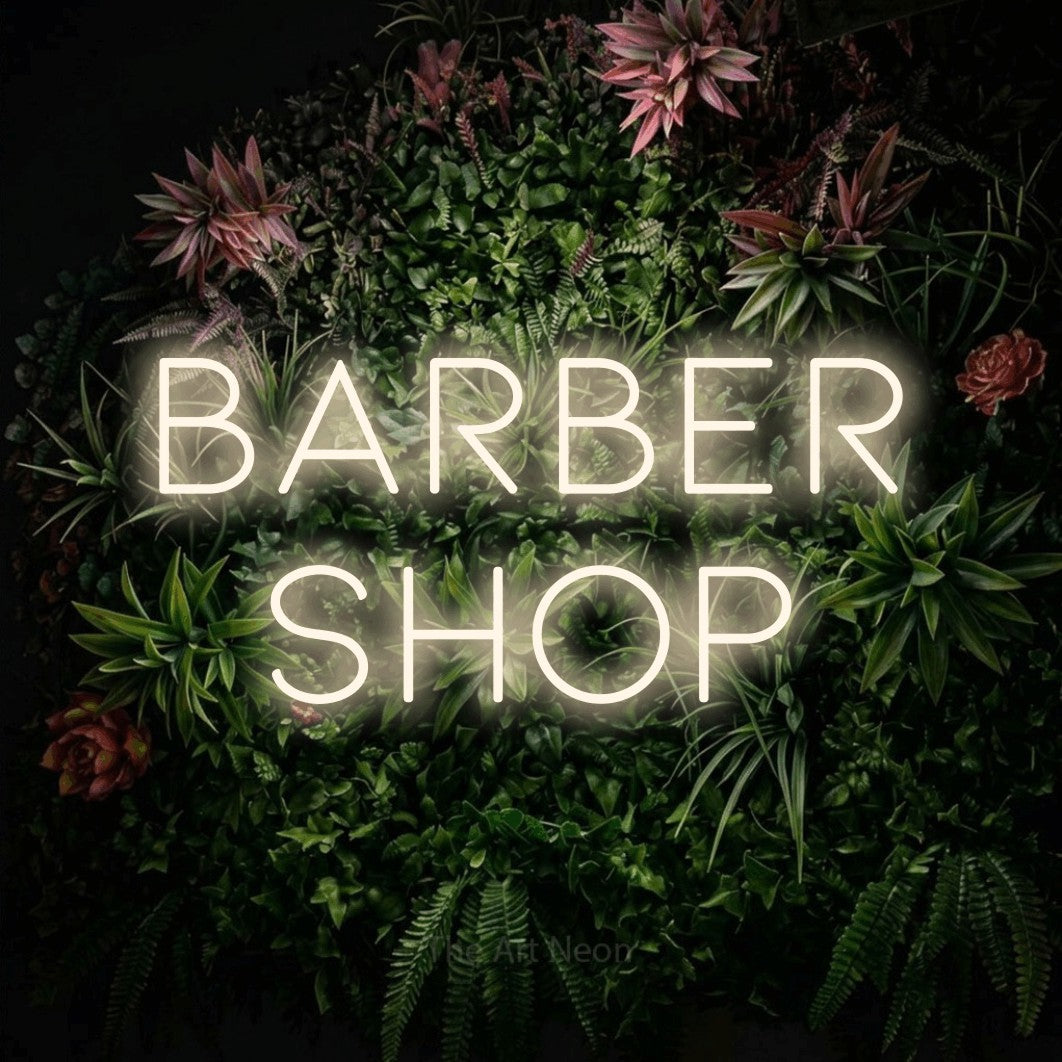LED neon sign reading “barber shop”, arranged in 2 lines.