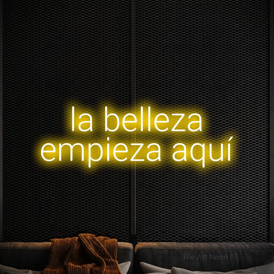 LED neon sign reading “la belleza empieza aquí”, arranged in 2 lines.