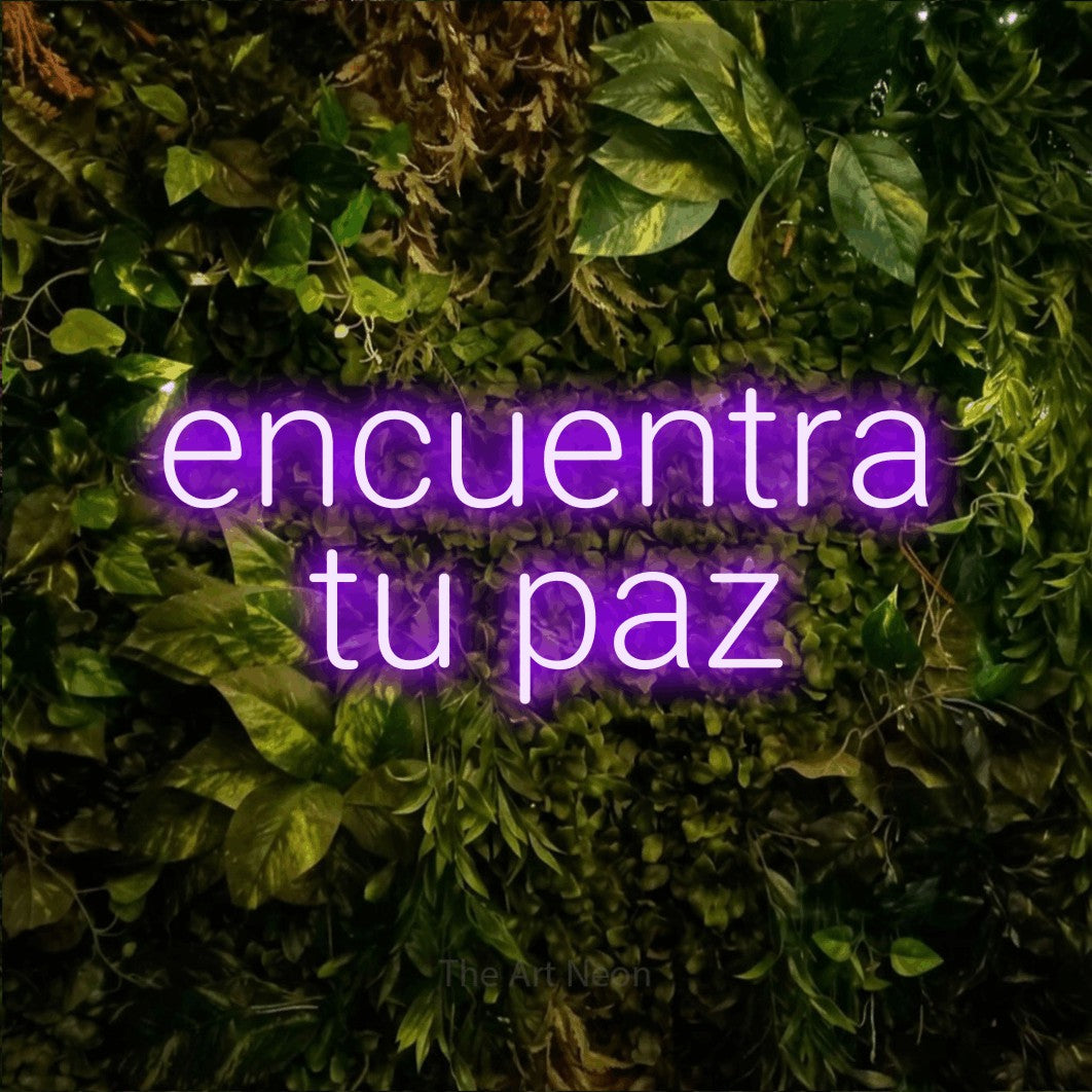 LED neon sign reading “encuentra tu paz”, arranged in 2 lines.