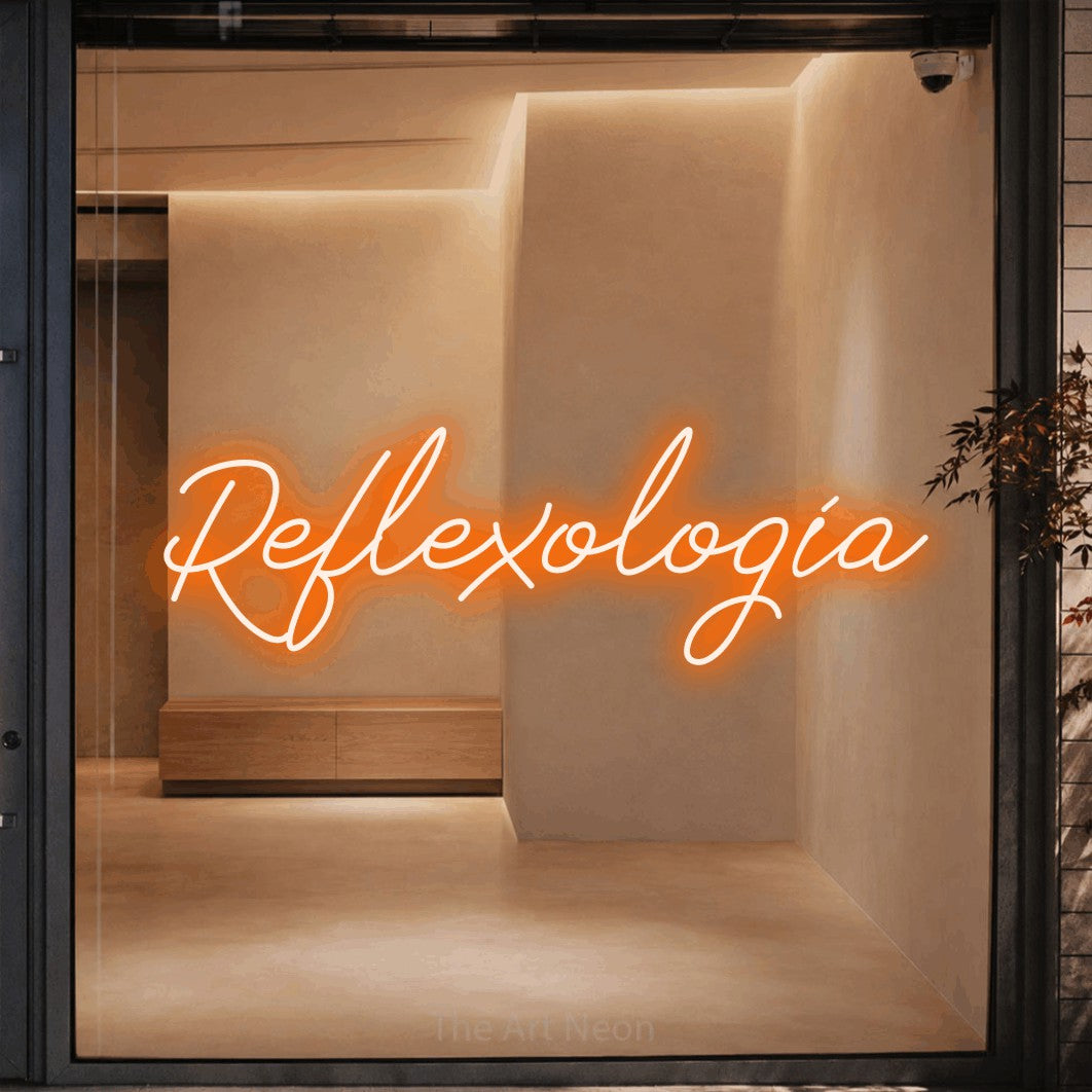 LED neon sign reading “Reflexología”, arranged in a single line.