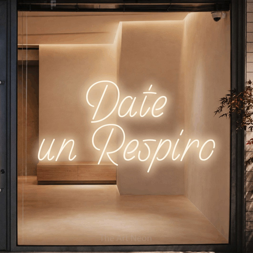 LED neon sign reading “Date un Respiro”, arranged in 2 lines.