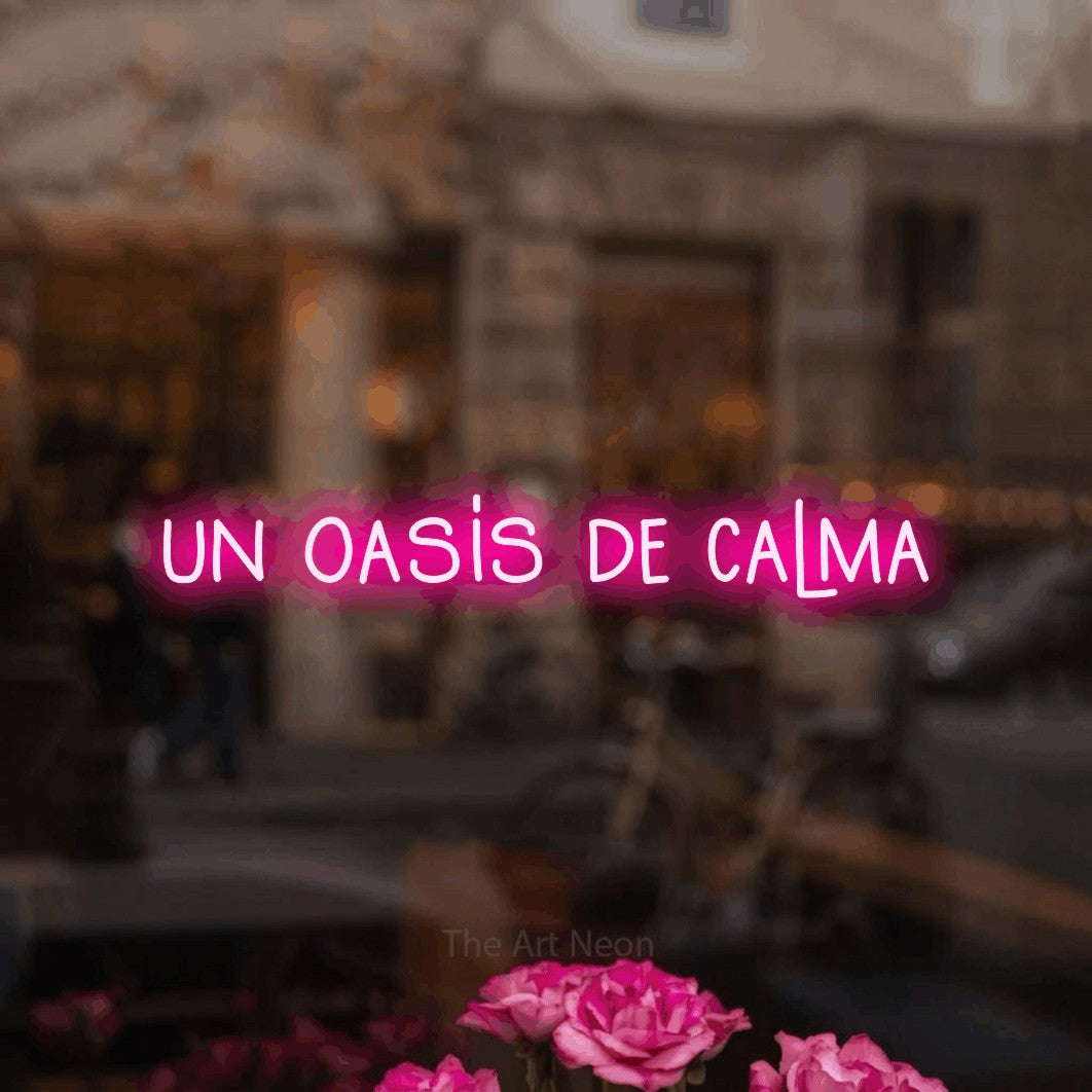 LED neon sign reading “un oasis de calma”, arranged in a single line.