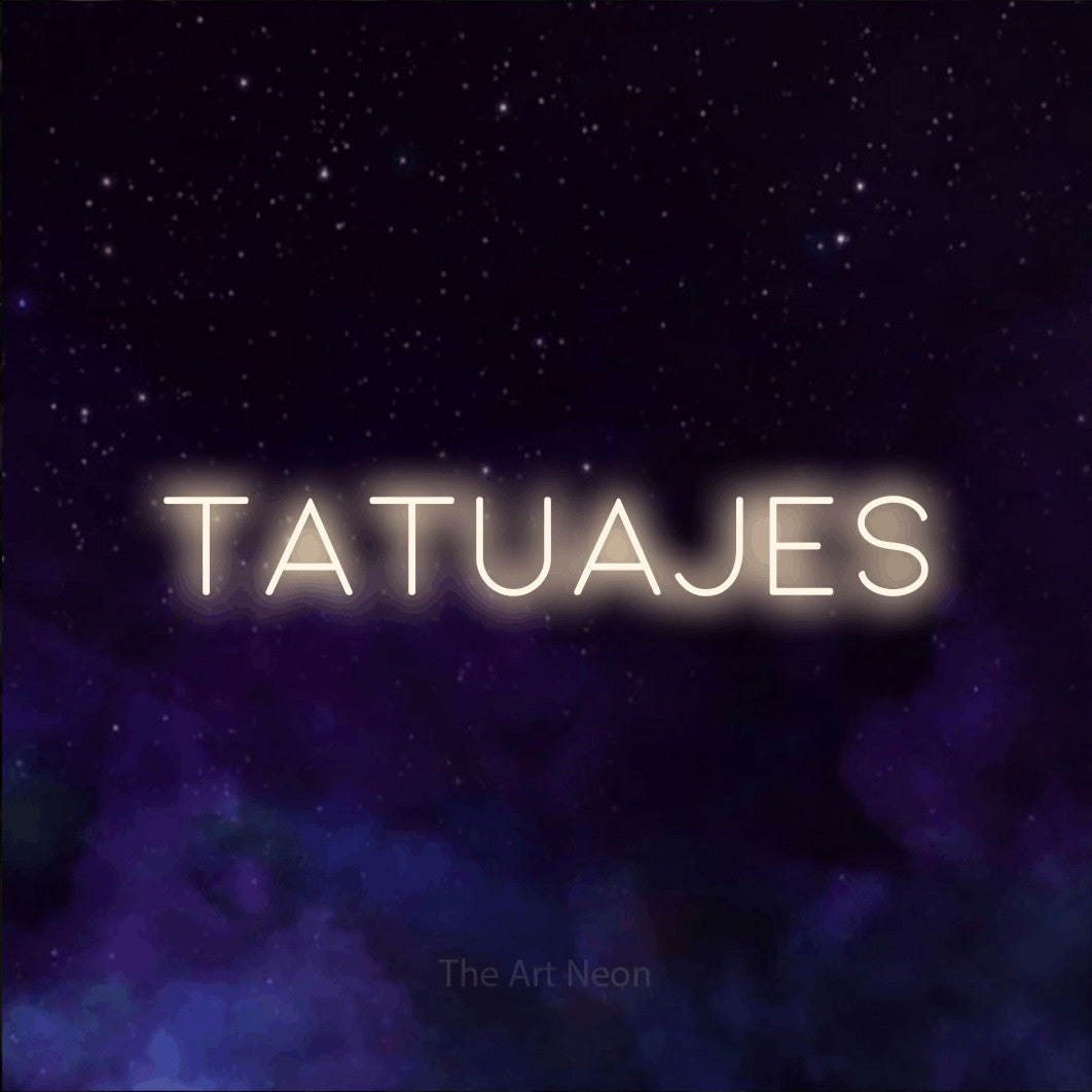 LED neon sign reading “tatuajes”, arranged in a single line.