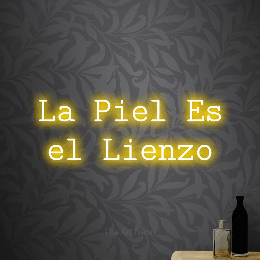 LED neon sign reading “La Piel Es el Lienzo”, arranged in 2 lines.