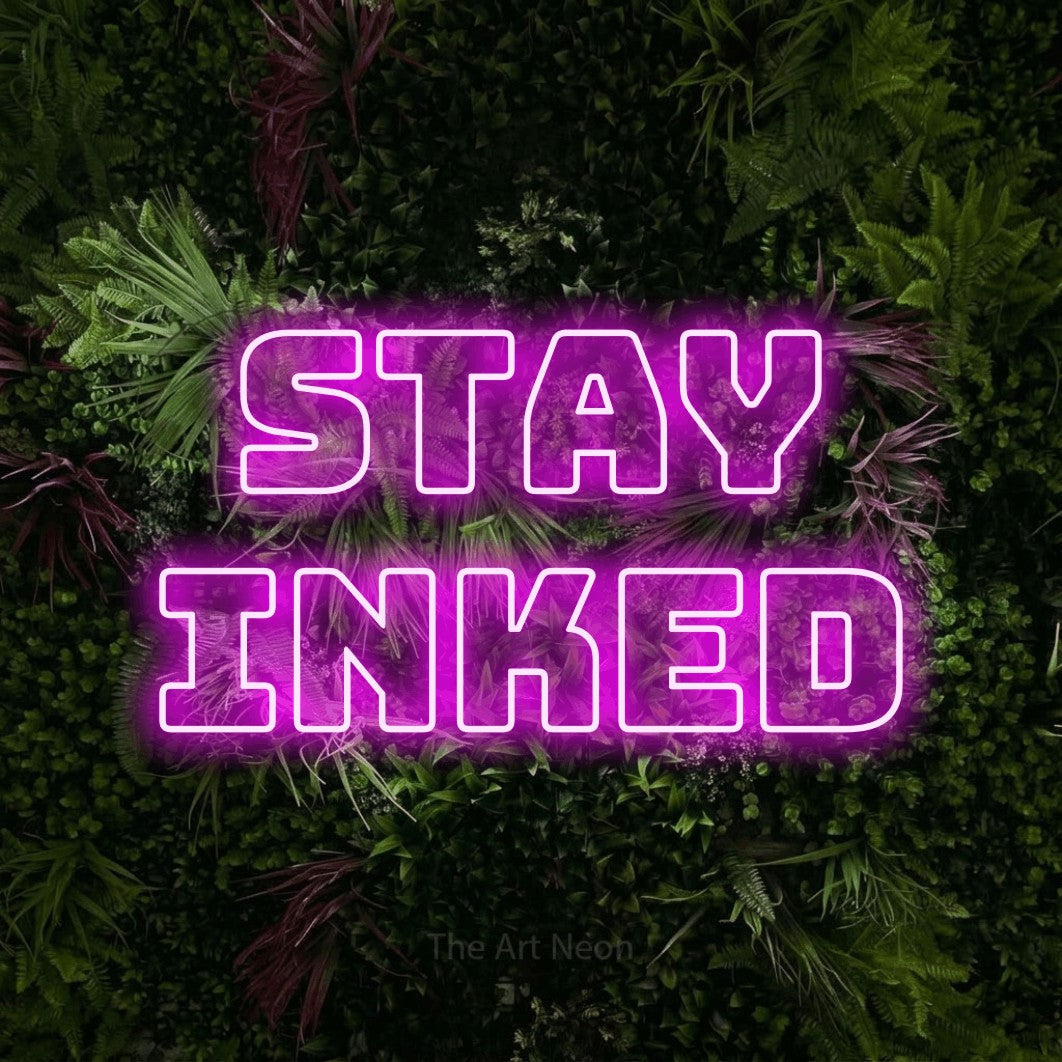 LED neon sign reading “stay inked”, arranged in 2 lines.