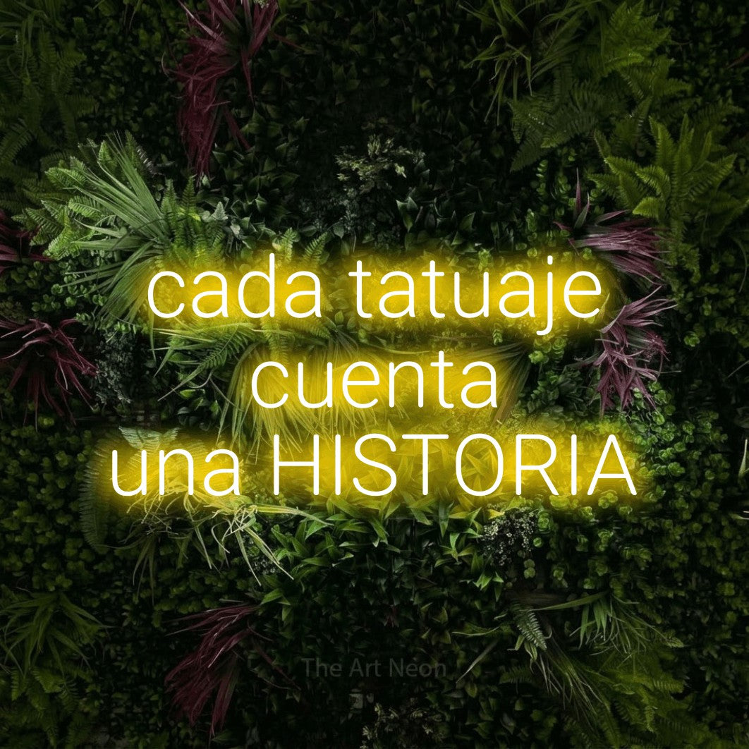 LED neon sign reading “cada tatuaje cuenta una HISTORIA”, arranged in 3 lines.
