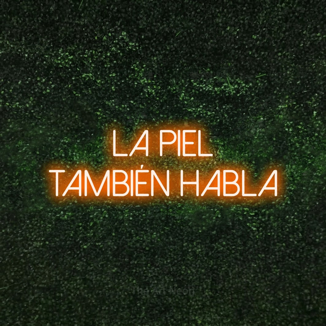 LED neon sign reading “La piel también habla”, arranged in 2 lines.