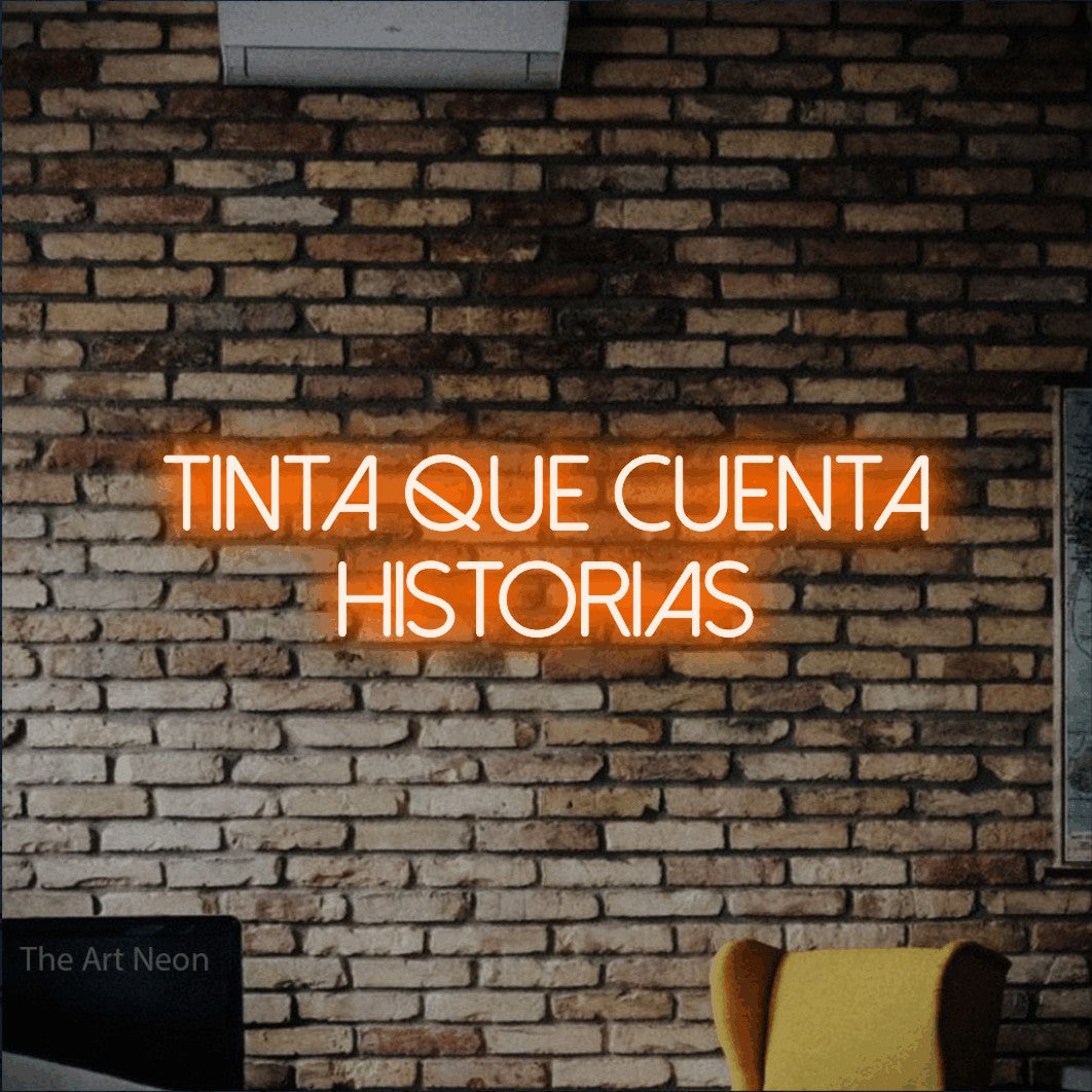 LED neon sign reading “tinta que cuenta historias”, arranged in 2 lines.