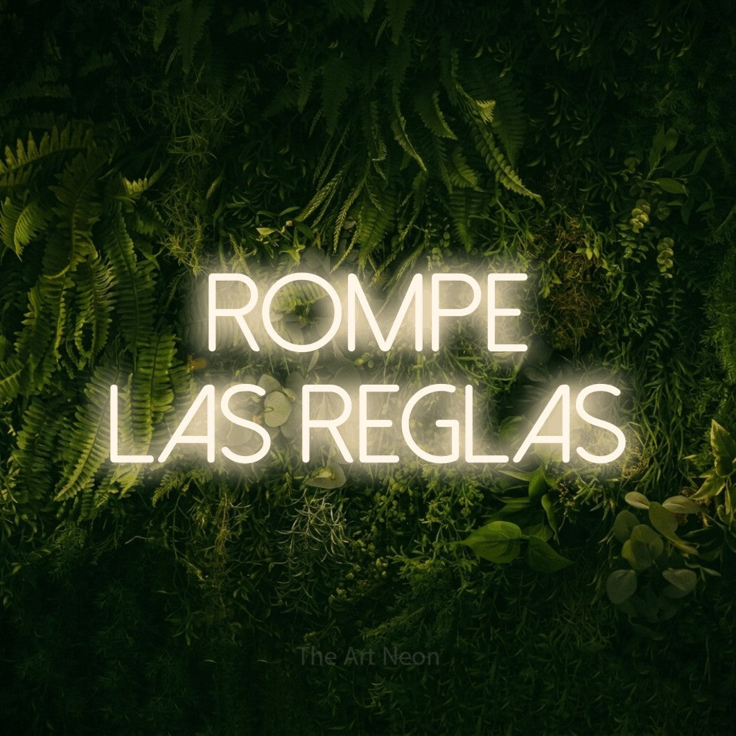 LED neon sign reading “Rompe las Reglas”, arranged in 2 lines.