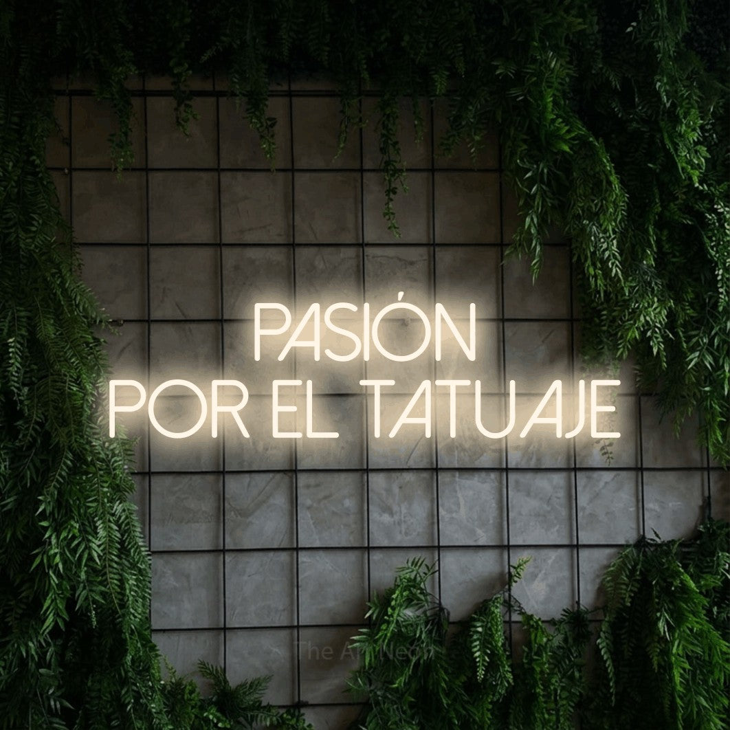 LED neon sign reading “PASIÓN POR EL TATUAJE”, arranged in 2 lines.