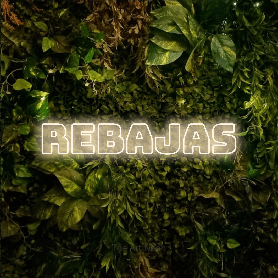 LED neon sign reading “REBAJAS”, arranged in a single line.